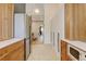 Updated kitchen with stainless steel appliances, white cabinets, and open design at 11358 W 85Th Pl # E, Arvada, CO 80005