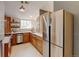 Updated kitchen boasts stainless steel appliances, designer backsplash, and abundant wood cabinetry at 11358 W 85Th Pl # E, Arvada, CO 80005