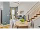 This living room features a staircase with sleek metal railings and a ceiling fan at 11358 W 85Th Pl # E, Arvada, CO 80005