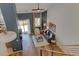 Spacious living room with vaulted ceilings, hardwood floors, and sliding glass doors at 11358 W 85Th Pl # E, Arvada, CO 80005