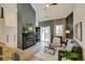 Inviting living room features a fireplace, hardwood floors, a ceiling fan and a sliding glass door to the deck at 11358 W 85Th Pl # E, Arvada, CO 80005