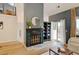 Bright living room featuring a fireplace with decorative tile, and a sliding glass door to the deck at 11358 W 85Th Pl # E, Arvada, CO 80005