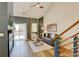 Bright living room showcasing hardwood floors, fireplace, and sliding glass doors at 11358 W 85Th Pl # E, Arvada, CO 80005