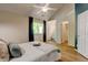 Spacious primary bedroom with an ensuite bathroom, ample natural light, vaulted ceiling and tasteful design, creating a private sanctuary at 11358 W 85Th Pl # E, Arvada, CO 80005