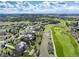 Expansive aerial shot showcases the community, surrounding landscape and golf course views of the property at 5409 Sedona Dr, Parker, CO 80134