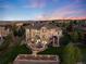 Aerial twilight view of a luxury home featuring a large yard and outdoor living areas at 5409 Sedona Dr, Parker, CO 80134