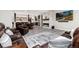 Finished basement with a large seating area, stone fireplace, bar, wood floors, and ample lighting at 5409 Sedona Dr, Parker, CO 80134