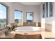 Relaxing bathtub with scenic views from the surrounding windows at 5409 Sedona Dr, Parker, CO 80134