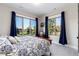 Bright bedroom with large windows offering beautiful views and stylish blue curtains at 5409 Sedona Dr, Parker, CO 80134