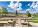 Bocce ball court with stone wall and manicured lawn, perfect for backyard games and recreation at 5409 Sedona Dr, Parker, CO 80134