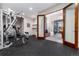 Home gym featuring an open entry with French doors to the billiards room at 5409 Sedona Dr, Parker, CO 80134