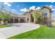 Stunning stone home with a three-car garage and a beautifully landscaped front yard with a circular driveway at 5409 Sedona Dr, Parker, CO 80134