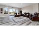Inviting living room with a leather furniture set and large sliding glass doors leading to an outdoor patio at 5409 Sedona Dr, Parker, CO 80134