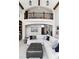 Spacious living room with a second-story view, comfortable seating, and a grand archway to the foyer at 5409 Sedona Dr, Parker, CO 80134