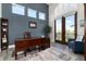 Bright and airy office space with large windows, a desk and stylish decor at 5409 Sedona Dr, Parker, CO 80134