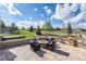 Outdoor stone patio with seating around a fire pit offering scenic views at 5409 Sedona Dr, Parker, CO 80134