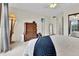 Spacious main bedroom with neutral colors, a cozy bed, and ample closet space at 14430 W Yale Pl, Lakewood, CO 80228
