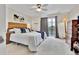 Serene main bedroom with a sliding glass door, ceiling fan, and plush carpet at 14430 W Yale Pl, Lakewood, CO 80228