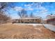 Expansive backyard with a covered patio, ideal for outdoor entertaining and relaxation at 3423 S Glencoe St, Denver, CO 80222