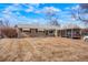 Charming single-story home with a tidy front yard and a convenient covered parking area at 3423 S Glencoe St, Denver, CO 80222