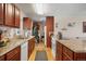 Spacious kitchen featuring dark wood cabinetry and granite countertops, ideal for cooking at 3423 S Glencoe St, Denver, CO 80222