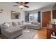 Comfortable living room with hardwood floors and large windows, providing ample natural light at 3423 S Glencoe St, Denver, CO 80222