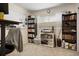 Office with bookshelves and a desk next to a window with blinds and curtains at 3423 S Glencoe St, Denver, CO 80222