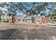 Wide shot of the townhome community highlighting ample parking and architectural details at 9758 W Cornell Pl, Lakewood, CO 80227