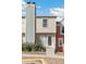 Charming exterior view of the townhome showcasing a well-maintained front entrance and landscaping at 9758 W Cornell Pl, Lakewood, CO 80227