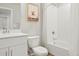Bright bathroom features a shower and tub combination and decorative dog print in frame at 6393 N Malaya St, Aurora, CO 80019