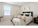 Cozy bedroom with a comfortable bed, soft carpet and a window that provides natural light at 6393 N Malaya St, Aurora, CO 80019