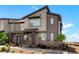Attractive home exterior boasting stylish design elements and well-maintained landscaping under a bright, sunny sky at 6393 N Malaya St, Aurora, CO 80019