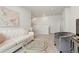 Comfortable upstairs living area with neutral decor, plush seating and an open layout at 6393 N Malaya St, Aurora, CO 80019
