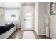 Inviting living room with light wood floors, a modern sofa and plenty of natural light at 6393 N Malaya St, Aurora, CO 80019