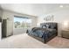 Spacious Primary bedroom featuring a large window and plush carpeting and sophisticated decor at 6393 N Malaya St, Aurora, CO 80019