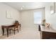 Home office with a wood desk, rolling chair, neutral walls, and carpet flooring at 6393 N Malaya St, Aurora, CO 80019