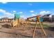 Community playground featuring swings, slides, and play structures at 6393 N Malaya St, Aurora, CO 80019