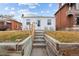Front view of a charming bungalow with steps leading to the entrance at 2229 S Bannock St, Denver, CO 80223
