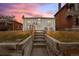 Welcoming single-story home with warm lighting, sunset, and a quaint front entrance at 2229 S Bannock St, Denver, CO 80223
