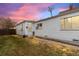 Ranch style home with a yard and satellite dish at 2229 S Bannock St, Denver, CO 80223