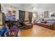 Living room decorated for the holidays with hardwood floors and leather furniture at 2229 S Bannock St, Denver, CO 80223