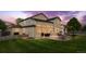 Well-maintained backyard with a lush green lawn, spacious patio, and charming fence at 133 Heritage Ave, Castle Rock, CO 80104