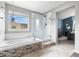 Bathroom featuring soaking tub and separate glass shower, next to a bedroom at 133 Heritage Ave, Castle Rock, CO 80104
