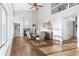 Open concept dining room with high ceilings, a fireplace, and hardwood floors at 133 Heritage Ave, Castle Rock, CO 80104