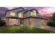 Charming two-story home with a three car garage and well-manicured lawn at 133 Heritage Ave, Castle Rock, CO 80104