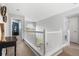 Open hallway featuring white railings, neutral walls, and decorative accents at 133 Heritage Ave, Castle Rock, CO 80104