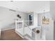 Second floor landing features natural lighting from the arched window and an open stairwell at 133 Heritage Ave, Castle Rock, CO 80104