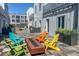 Relaxing courtyard setting with a fire pit and colorful seating at 2550 Lawrence St # 106, Denver, CO 80205
