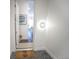 Bright entryway featuring a stylish 'welcome' mat, modern lighting, and a glimpse into the home's inviting interior at 2550 Lawrence St # 106, Denver, CO 80205