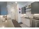 Well-lit kitchen showcases sleek countertops, stainless steel appliances, and subway tile backsplash, creating a modern space at 2550 Lawrence St # 106, Denver, CO 80205